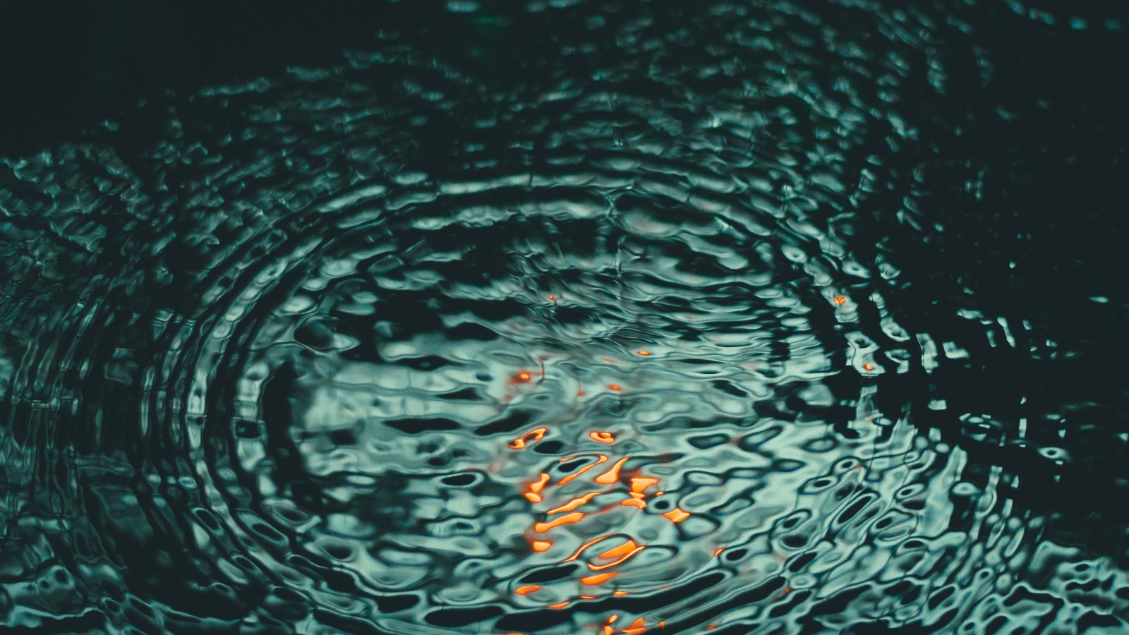 Close-up of light refracting through moving water