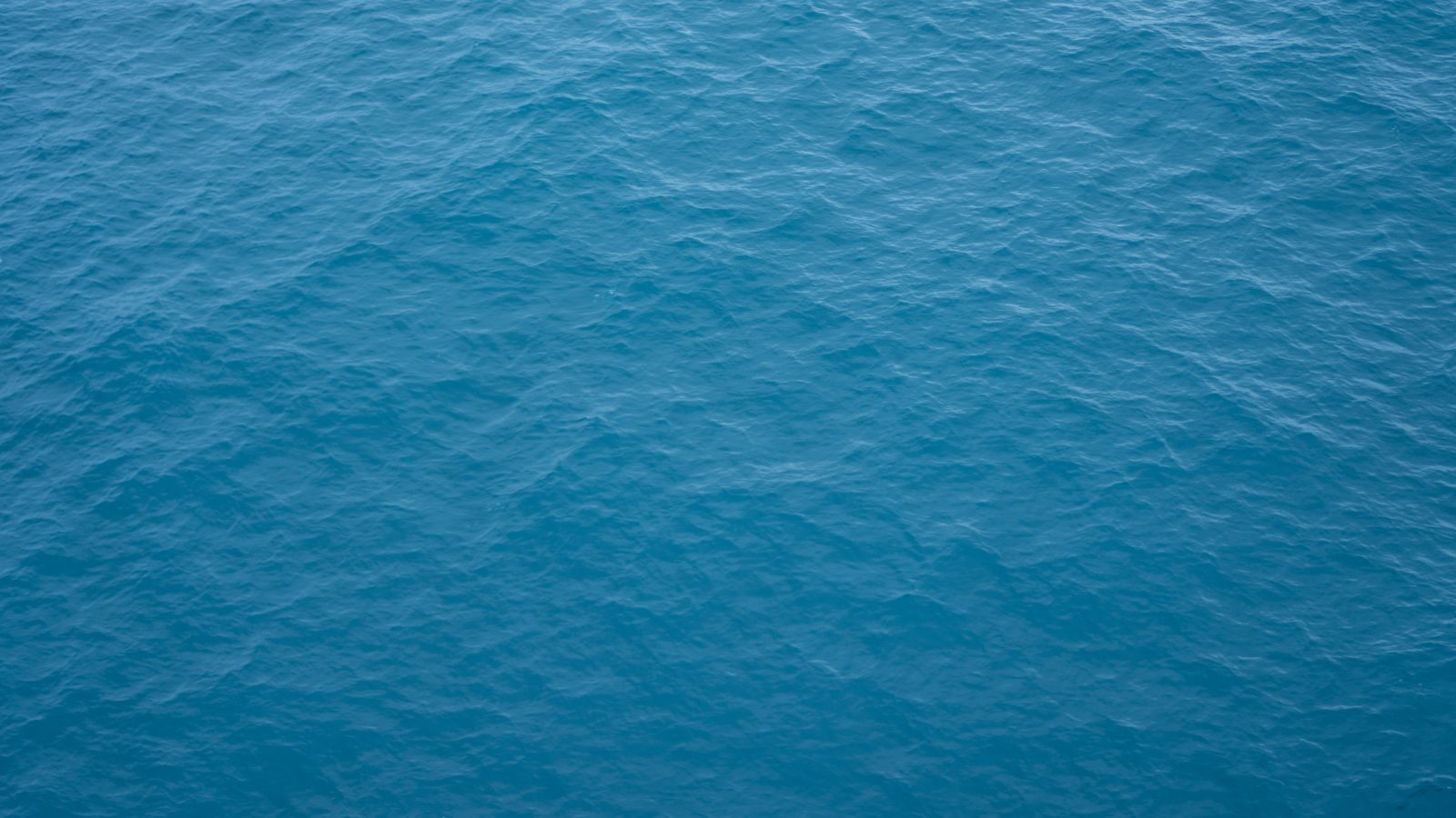 Why we cast water into glass instead of onto it